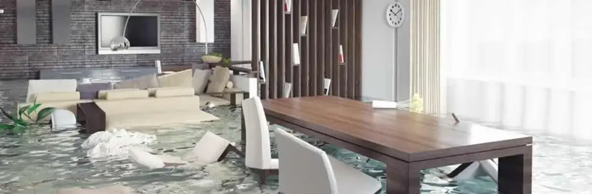 home interior affected by water damage with flooded floors and displaced furniture in Cambridge, MA